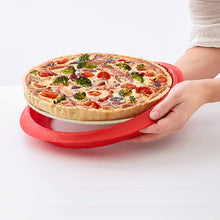 Removing silicone mold from ceramic dish and prepared quiche