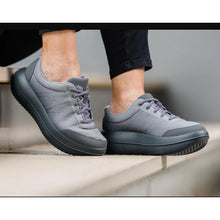 Pair of kybun Bauma Dark-Grey being worn, on steps