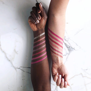 7 cream blush swatches on dark and white arms
