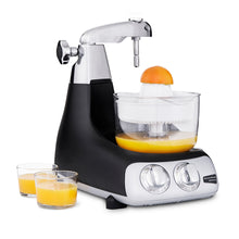 Ankarsrum Assistent Citrus Press in use