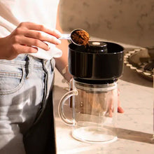 Filling VacOne Air Brewer with coffee