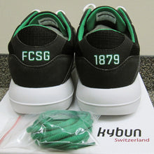 rear view of Kybunpark shoes, with package of extra green laces