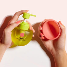 holding Nixit Personal Lubricant and menstrual cup