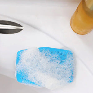 a Silicone Soap Saver on a bathroom sink after use