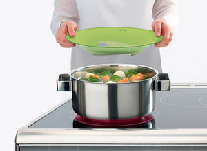 Lowering a Lekue Non-Spill Lid onto a pot
